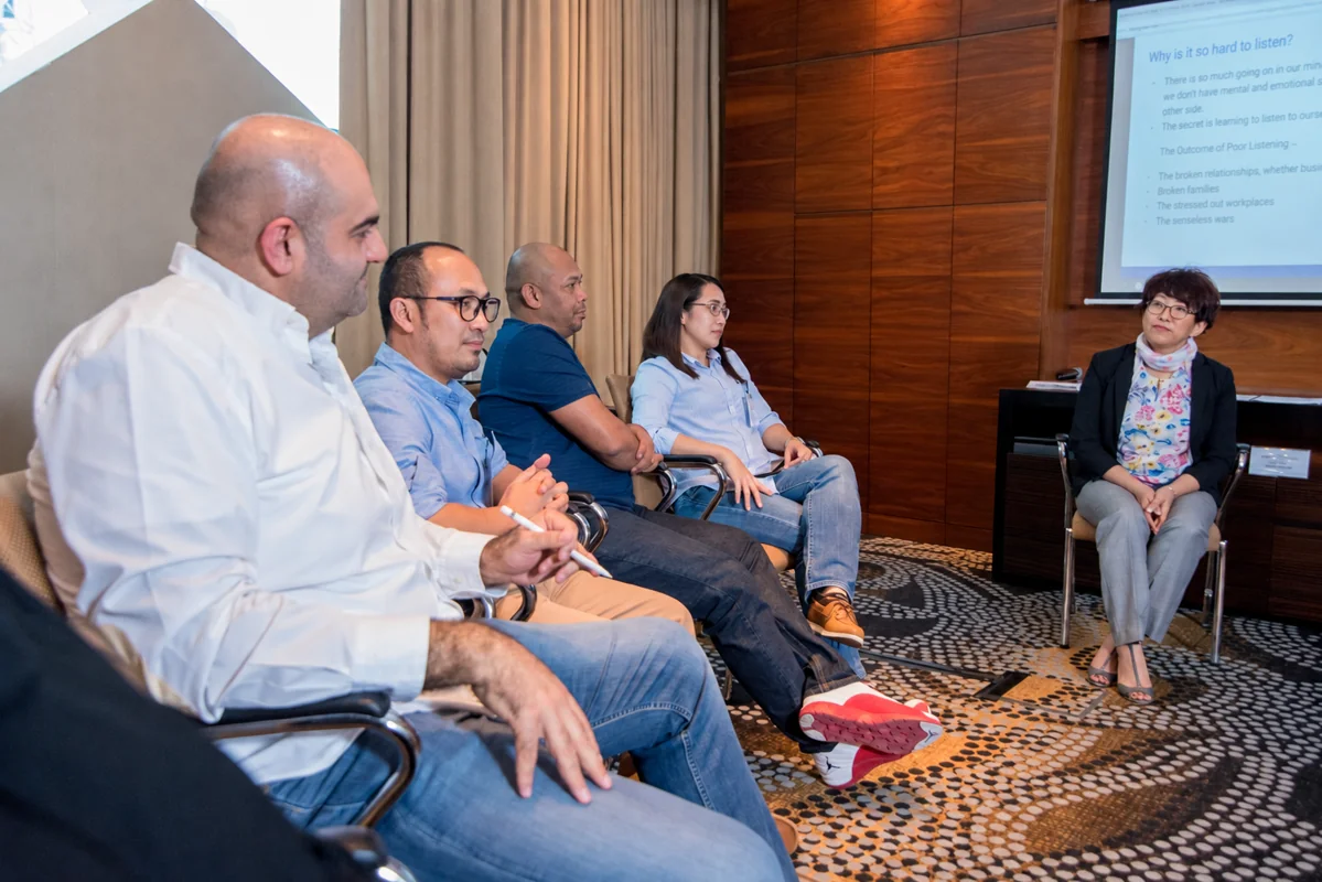 Participants listening during a facilitated group discussion
